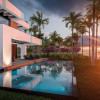 3d rendering of modern cozy house with pool and parking for sale or rent in luxurious style by the sea or ocean. Sunset evening by the azure coast with palm trees and flowers in tropical island